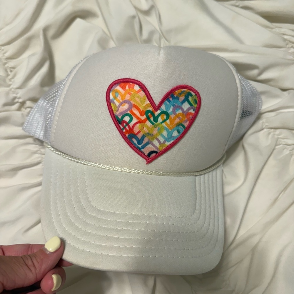 White Trucker Hat with Colorful Heart Patch